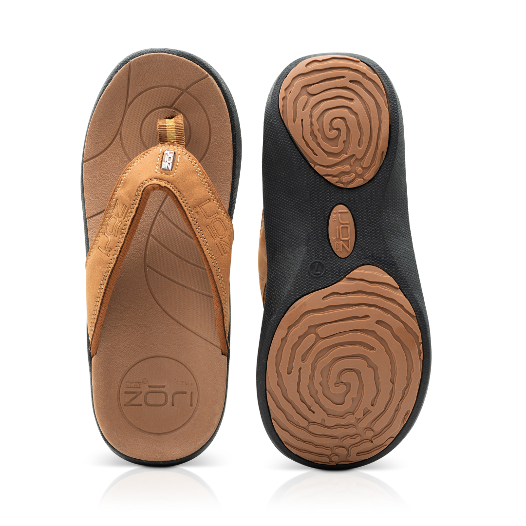 Neat Zori Cognac/Black Orthotic Sandals, top view with both sandals displayed side by side, one flipped to show its underside with mostly black and brown pads.
