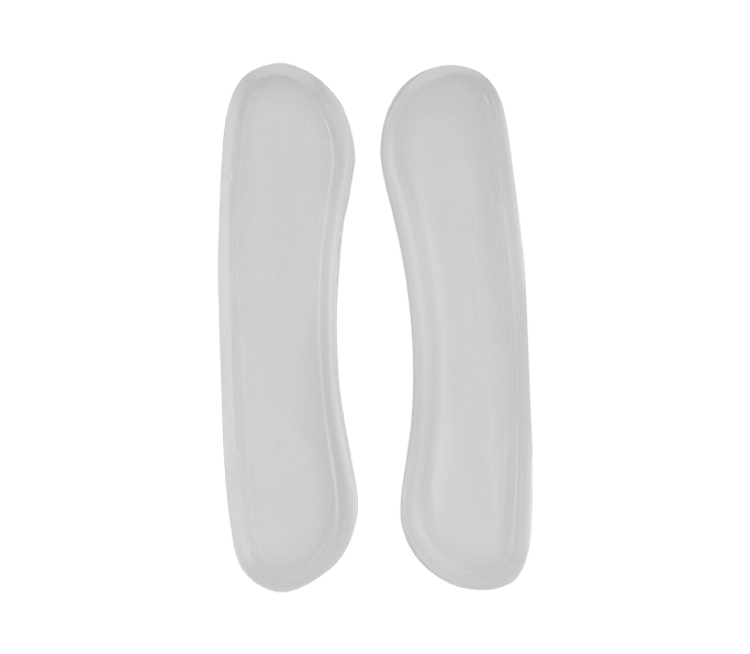 Two white, semi-translucent Neat Feat Femme Gel Heel Shields side by side, showcasing their soft, cushioned design for heel protection and comfort.