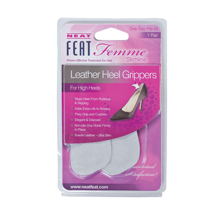 Neat Feat Femme Leather Heel Grippers, in mostly pink packaging with mostly white text, featuring a clear plastic cover that exposes the light grey grippers inside. The front includes an image of a shoe showing where to install the grippers for added comfort and support.