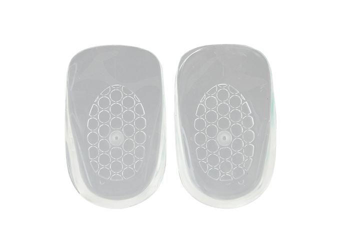 Two white, semi-translucent Neat Feat Gel Heel Cushions side by side, showcasing their soft, contoured design for heel support and comfort.